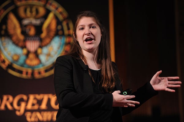 Heather Artinian with Georgetown seal behind her