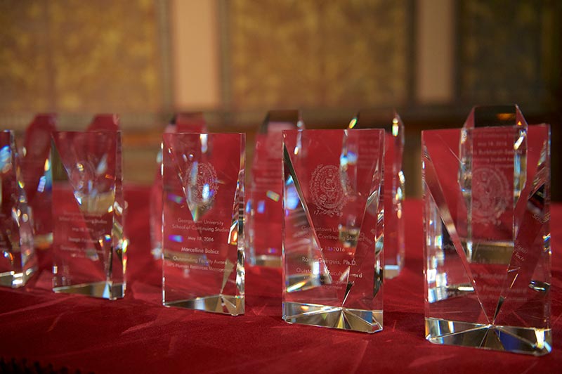 A group of SCS Faculty Awards sits on a table