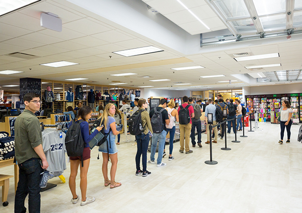 Students stand in a long line to purchase books in the new bookstore