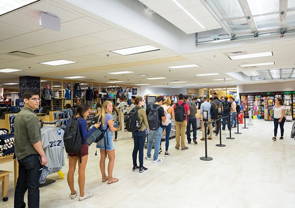 Students stand in a long line to purchase books in the new bookstore