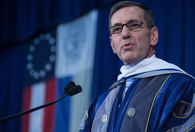 Bruce Broussard speaks during the business school commencement ceremony