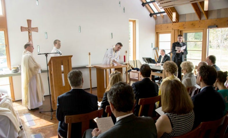 Members of the university community attend Mass in the center's Chapel of St. Ignatius of Loyola.