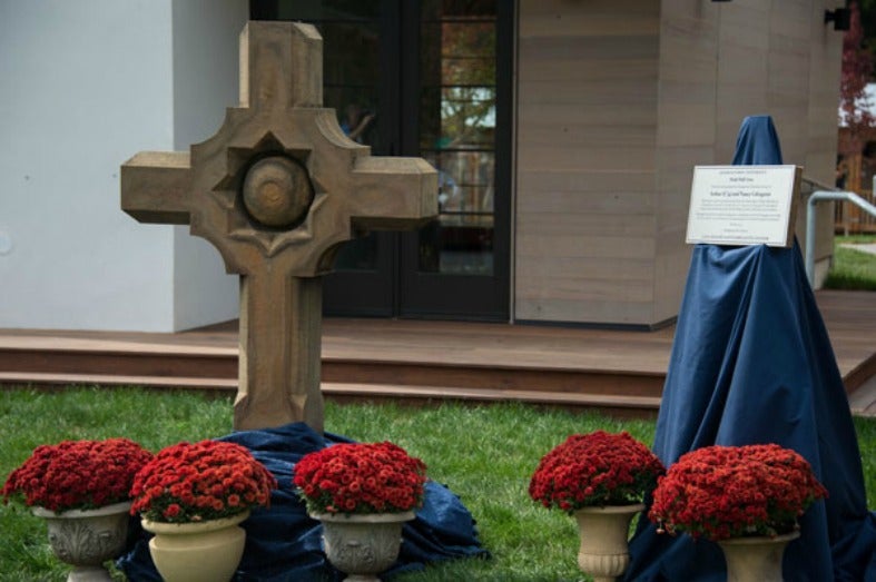 A closeup of a stone cross that Georgetown presented to the Calcagninis.