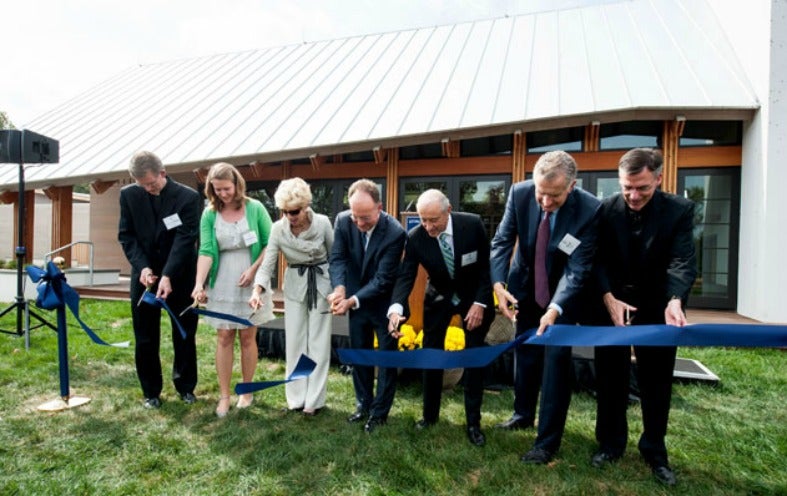 The Calcagninis, Philip Boroughs, Magdalena Buczek, John J. DeGioia, Paul Tagliabue, and Kevin O'Brien cut the ceremonia ribbon.