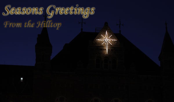 A graphic reads Seasons Greetings from the Hilltop with Healy Hall in the background