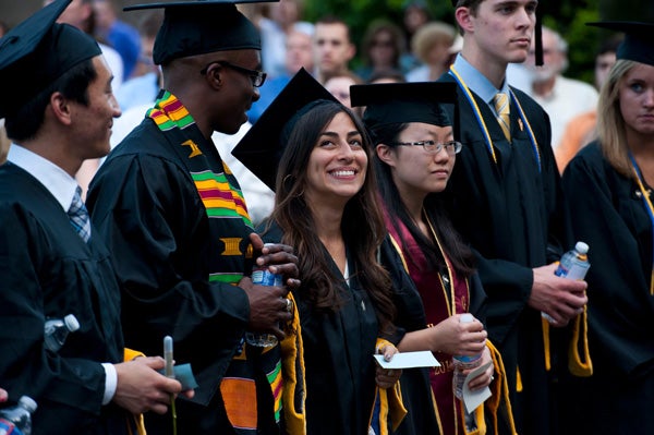 MSB Graduates standing on Healy Lawn during ceremony