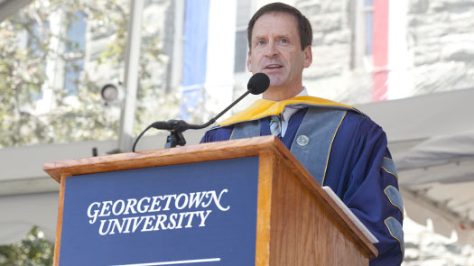 Mark Green speaks at a podium on the stage on Healy Lawn