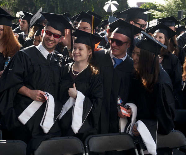 Graduate School of Arts and Sciences graduates pose for pictures