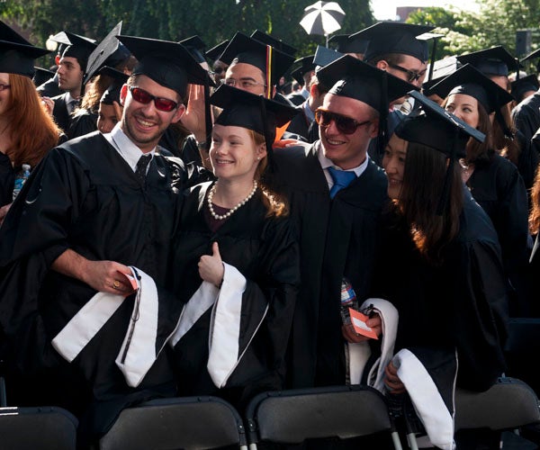 Graduate School of Arts and Sciences graduates pose for pictures