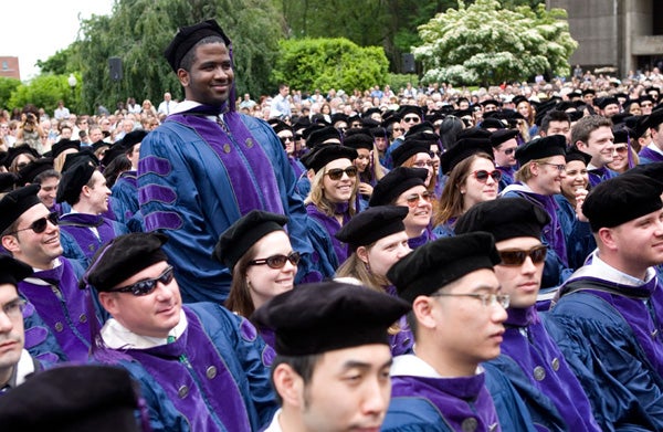 Christopher Ezekiel Nelson stands during ceremony on Healy Lawn