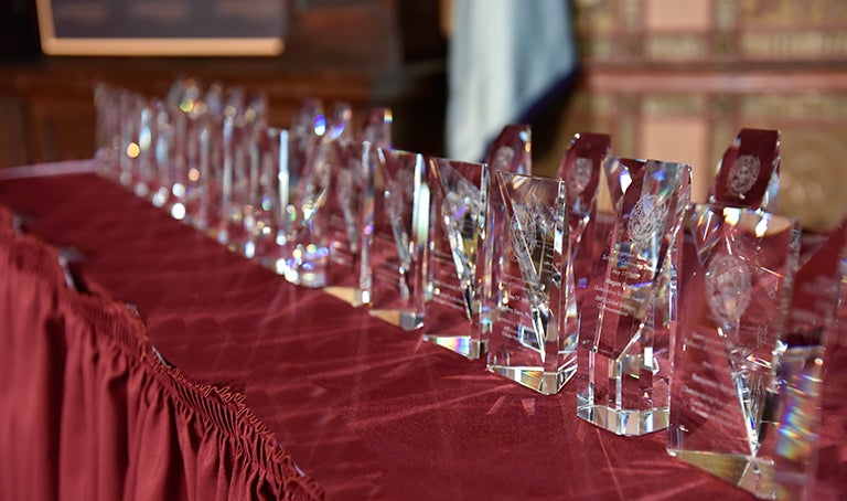 awards for faculty and staff sit on a table