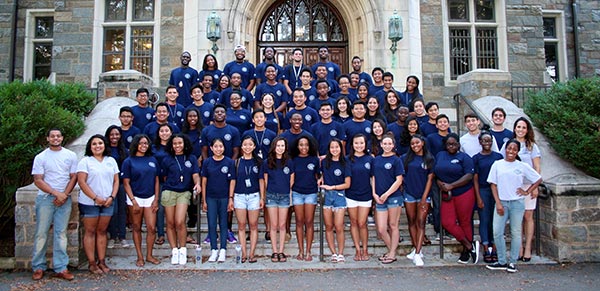 large group of students stand on the steps of White-Gravenor Hall