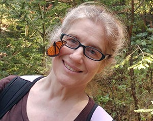 Leslie Ries with butterfly on her face