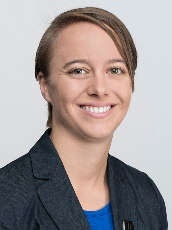 Headshot of Ashley Nicolas with gray background