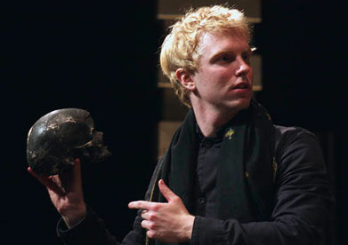 Michael Benz holds a skull while playing Hamlet