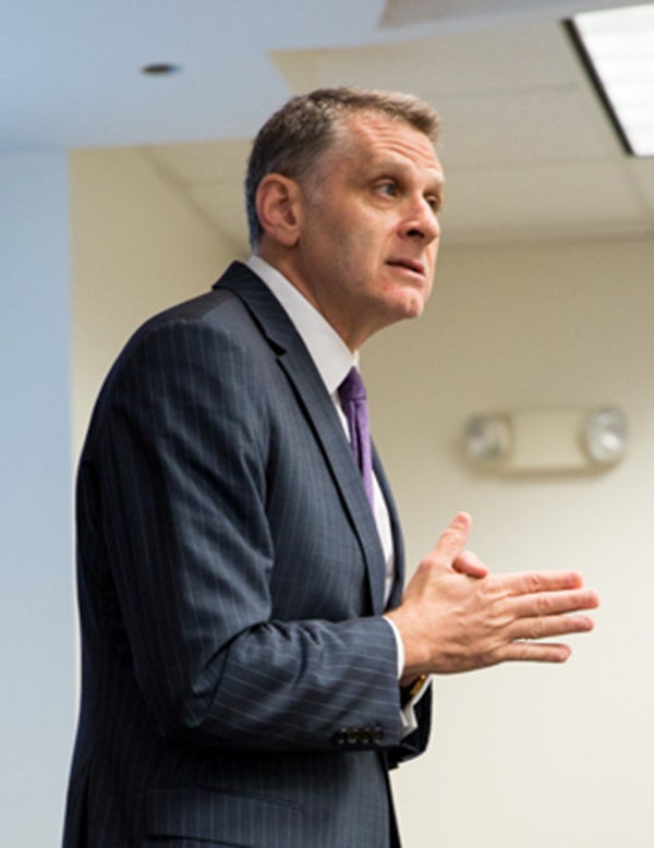 Professor Jacques Berlinerblau stands delivering a lecture to his class.