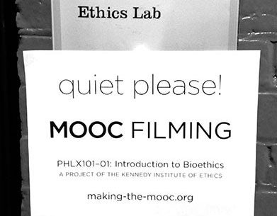 A sign outside the Ethics Lab reads "quiet please! MOOC FILMING."