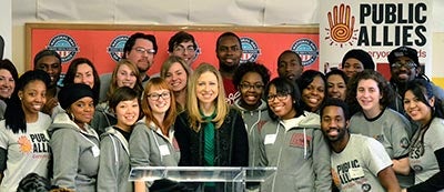 Chelsea Clinton poses with a group of Public Allies during a service event