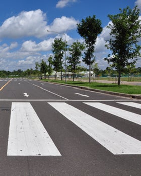 A photo of a crosswalk in the middle of an empty street. 