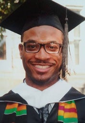 Derek Dangerfield in graduation regalia