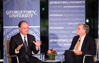 Georgetown President John J. DeGioia answers a question posed by Georgetown Provost Robert Groves during a discussion at the "Designing the Future(s) of the University" launch event.