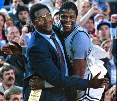 Coach Thompson and Patrick Ewing (C'85) smile and embrace after winning the national championship.