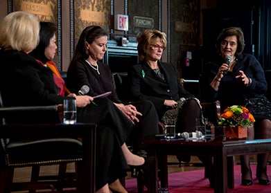 Melanne Verveer, Cherie Blair, Anne Finucane, Mari Pangestu, and Ofra Strauss on Gaston Hall's stage.