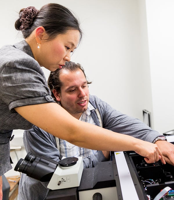 Jong-In Hahm works with a graduate student in her lab