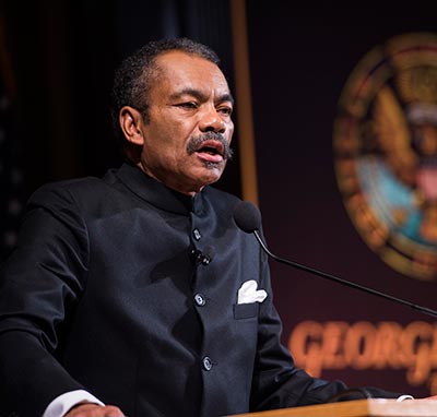 Maurice Jackson addresses the Gaston Hall audience from the podium.