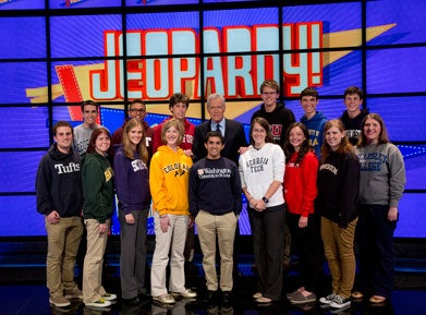 Jim Coury with Alex Trebek and other contestants on the set of Jeopardy!