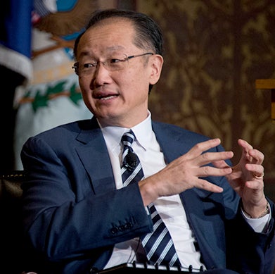 Dr. Jim Yong Kim, dressed in a blue suit, speaks in Gaston Hall.