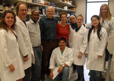 Jean Baptiste Mazarati S.J. poses with colleagues and Dr. Anton Wellstein in lab