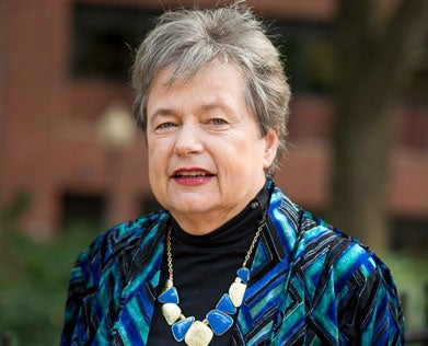 Carol Lancaster smiles for the camera in a headshot.