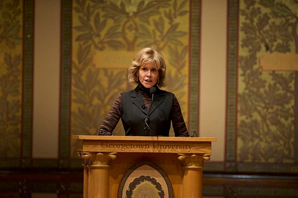 Jane Fonda at podium with Georgetown seal behind her