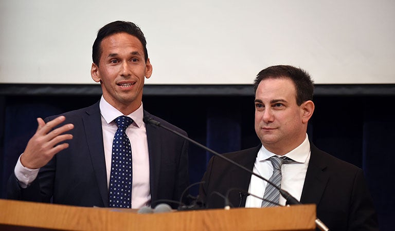 Marc Howard and Marty Tankleff behind podium on stage