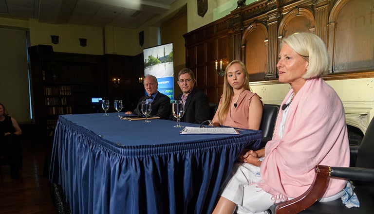 Bill McDonough, Timothy Warren, Caroline Bonfield and Elle Carberry sit at a table with glasses of water on it