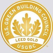 A photo of the LEED Gold Seal with the words "U.S. Green Building Council" encircling the border.