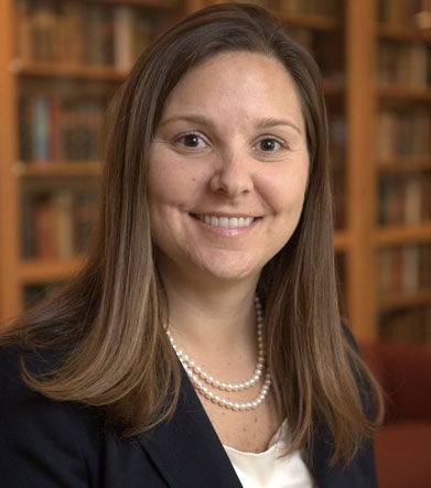 Joanna Lewis smiles in a headshot. 