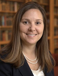 Joanna Lewis smiles in a headshot.