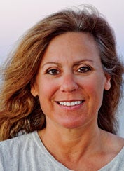 Janet Mann smiles in a headshot. 