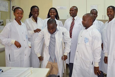 Jean Baptiste Mazarati poses with colleagues in lab