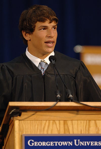 David Fajgenbaum at a Georgetown University podium