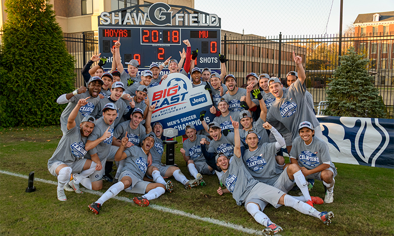 The men's soccer team poses together with their 2018 BIG EAST championship win.