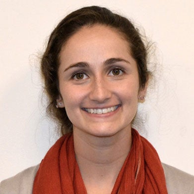Public Policy student Stephanie Keller Hudiburg smiles for the camera in a headshot.