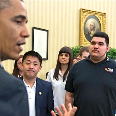 Public Allies and Americorps members listen to President Obama as he talks during their visit to the White House