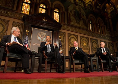 E.J. Dionne moderates a panel in Gaston Hall that includes President Obama, Harvard professor Robert Putnam and Arthur Brooks, president of the American Enterprise Institute.