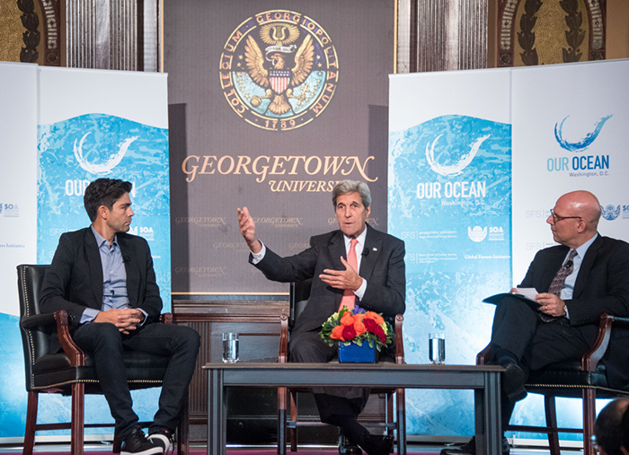 John Kerry, center, and Adrian Grenier, far left, discuss our world's oceans with Joel Hellman on-stage in Gaston Hall.