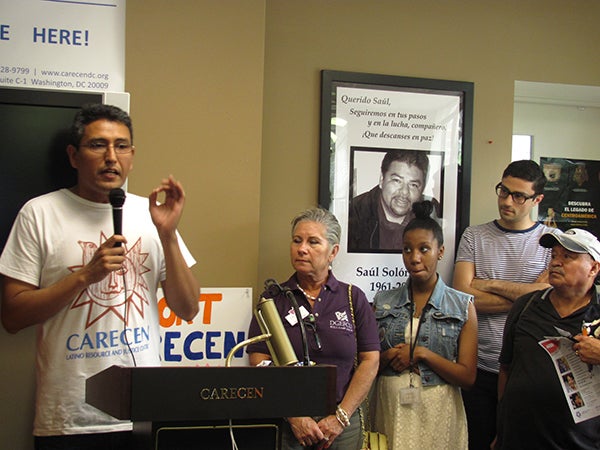 Abel Núñez speaks during a CARECEN Open House.