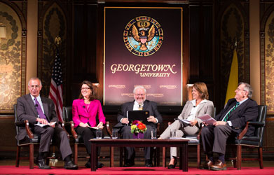 David Brooks, PBS NewsHour political analyst; Alexia Kelley, FADICA; John Carr, head of the new Initiative on Catholic Social Thought and Public Life; Kim Daniels, U.S. Catholic Bishops' Conference; and Mark Shields, PBS NewsHour political analyst discuss Pope Francis' papacy onstage in Gaston Hall.