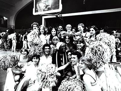 Actress and singer Pearl Bailey is surrounded by Georgetown basketball cheerleaders in this black and white photo circa 1980.